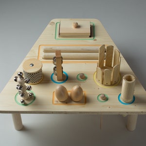 Percussion instruments on trapeze table, Eco friendly, Wooden instruments for children, Jingle stick, Sleight Bell, Sandy board, Wood Claves