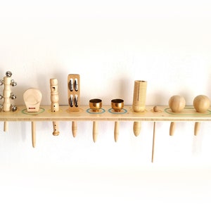 Percussion Instruments for Kids on Shelf Multi tone block Guiro Maracas Domroo Jingle stick Bells on the handles Castanet Wooden instruments