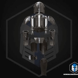 May include: A detailed illustration of a futuristic, dark gray and silver armor set, including a helmet, chest piece, and various protective components. The design features a sleek, metallic aesthetic with blue accents. The image includes the text "PATREON.COM/GALACTICARMORY".