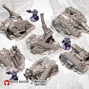 May include: A collection of gray miniature war machines and figures, including tanks, missile launchers, and soldiers. The models are set on rocky terrain, with a futuristic, industrial aesthetic. The "Battle Builder tech" and "TXARLI Factory" logos are visible.