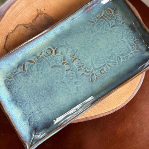 Handmade Ceramic trays both functional and decorative. Each tray is hand built and unique by texture, glaze finishes and size.