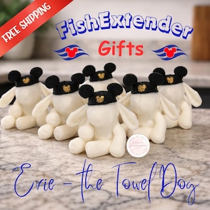 May include: A group of plush, white towel dogs wearing black hats with gold accents. The image includes text that reads "Fish Extender Gifts" and "Evie - the Towel Dog". A banner in the upper left corner reads "Free Shipping".