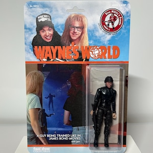 Action figure di Wayne's World personalizzata di un ragazzo che viene addestrato come nei film di James Bond, commedia degli anni '90 con Mike Myers e Dana Carvey - carta a due lati