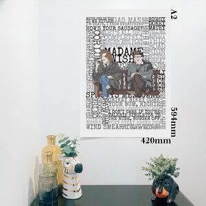 K&ouml;nnte beinhalten: Ein gerahmtes A2-Poster mit zwei M&auml;nnern auf einer Bank, umgeben von Text. Das Poster ist 420 mm breit und 594 mm hoch. Der Text enth&auml;lt S&auml;tze wie "Madame Wish" und "CRIKEY BIKEY CORK".