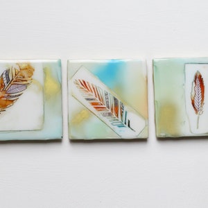 Mixed media 4.24&quot; x 4.25&quot; ea.  &#39;3 Feathers&#39;  alcohol ink, spray paint, posca ink & epoxy resin on ceramic tile original artwork
