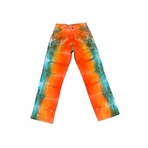 May include: A pair of orange, blue, and green tie-dye jeans. The jeans have a straight leg and a classic five-pocket design.