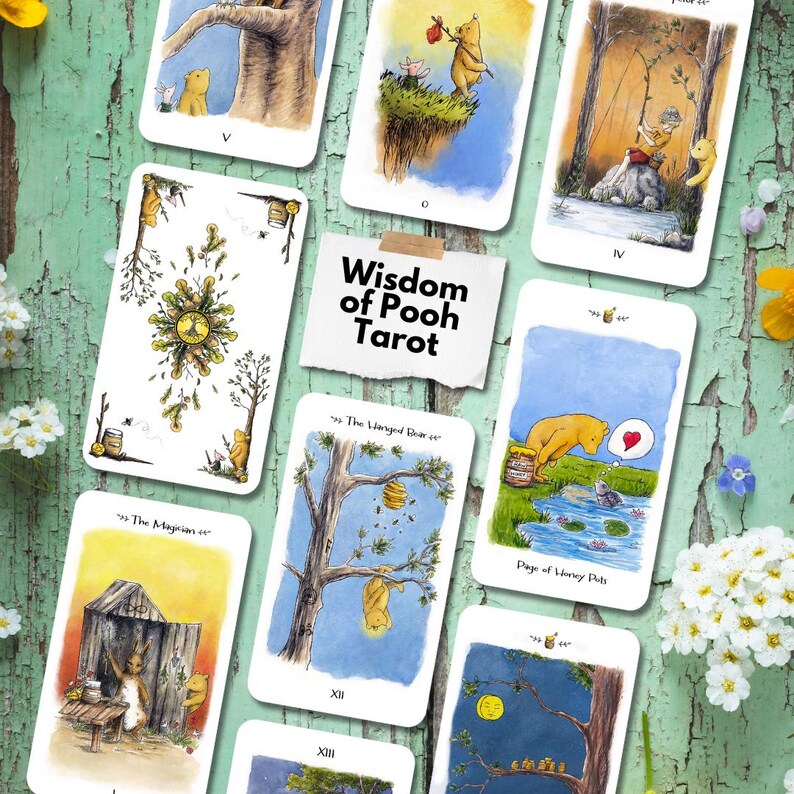 May include: A Wisdom of Pooh Tarot deck featuring multiple cards with watercolor illustrations of Winnie the Pooh characters in various scenes, including a card labeled The Magician and Page of Honey Pots, arranged around a central title card.