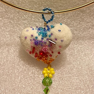 May include: A white ceramic mug with a black handle and the text "But First, Coffee" in a black, bold font. The mug is on a white surface.