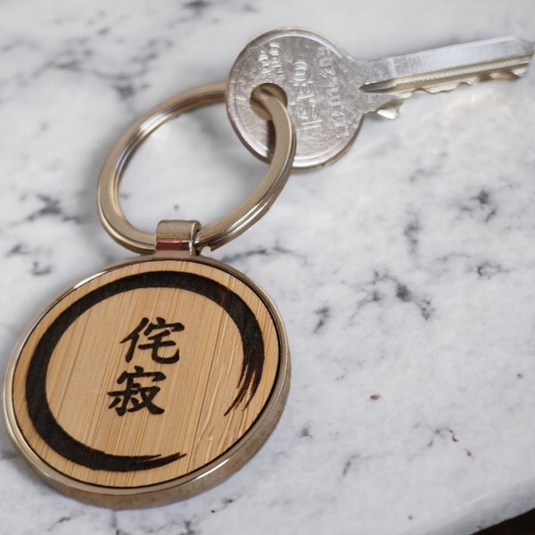 Wabi-Sabi key ring surrounded by the Enso (Japanese Zen circle), symbol of Buddhism and Taoism. Meditation, spirituality, calligraphy.
