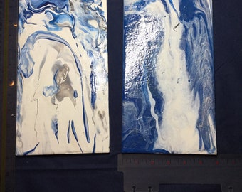 Custom acrylic design tile work  most tiles are from Italy . Acrylic paint with varnish and heat resistant.  Backs have cork on rubber feet.
