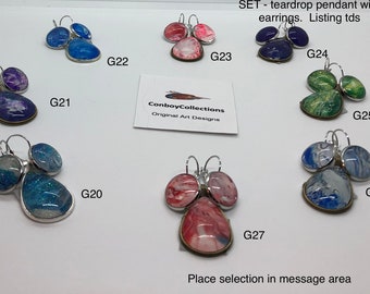 Teardrop pendant and matching earrings.  Various sets on sale.   Angel wing pendants and rotation (Double sided) pendants.