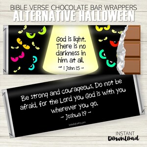 May include: Chocolate bar wrappers with Bible verses for an alternative Halloween theme. One wrapper features the text "God is light. There is no darkness in him at all." and the other says "Be strong and courageous." The wrappers have a black background.