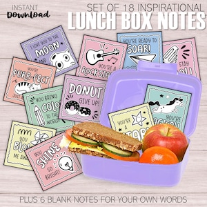 May include: A purple lunchbox filled with a sandwich, an apple, and a tangerine, surrounded by inspirational lunch box notes. The notes have various designs and phrases like "You're Purr-fect" and "You Shine So Bright!" The set includes 18 notes and 6 blank ones.