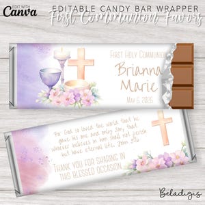 May include: A printable candy bar wrapper for a First Holy Communion celebration. The wrapper features a watercolour illustration of a chalice, a cross, and flowers in shades of pink and purple. The text on the wrapper reads "First Holy Communion", "Brianna Marie", "May 6, 2025", and a Bible verse from John 3:16. The wrapper also includes the text "Thank you for sharing in this blessed occasion."