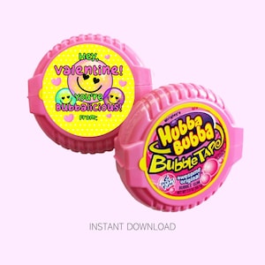 May include: Two pink Hubba Bubba Bubble Tape gum containers. One has a yellow label with the text "Hey, Valentine! You're Bubbalicious!" and smiley faces. The other has the Hubba Bubba logo.