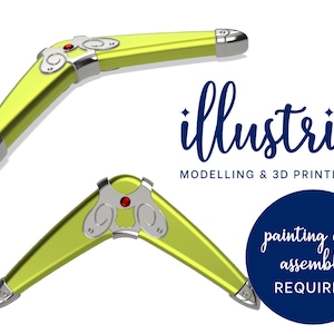 May include: Two yellow boomerangs with silver accents and red gems. The boomerangs are 3D printed and require painting and assembly. The image includes the text "illustris MODELLING & 3D PRINTING" and "painting and assembly REQUIRED".
