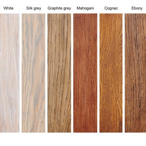 May include: Ten wood samples stained in different colors, including linseed oil, natural, white, silk grey, graphite grey, mahogany, cognac, ebony, gold, and silver.