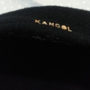 May include: Black wool beret with a gold "Kangol" logo.