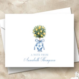 May include: A white card with a blue and white illustration of a lemon tree in a blue and white vase. The text "A note from Annabeth Thompson" is printed in blue below the illustration.