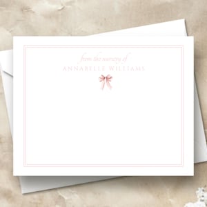 May include: A white card with a pink ribbon and the text "from the nursery of Annabelle Williams".