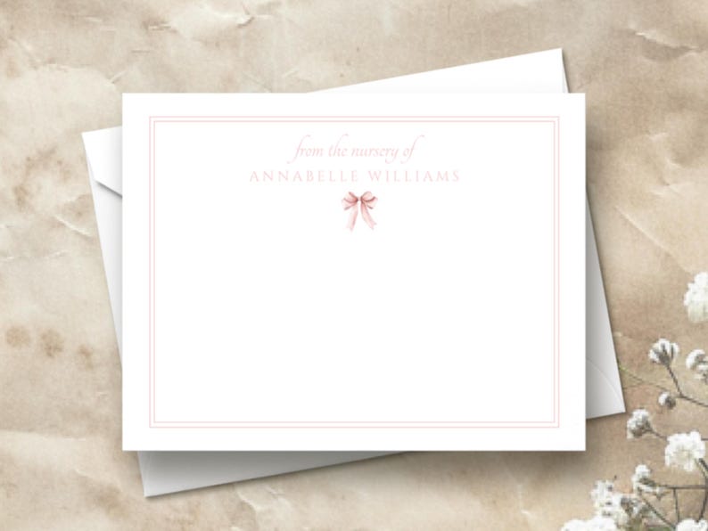 May include: A white card with a pink ribbon and the text "from the nursery of Annabelle Williams".