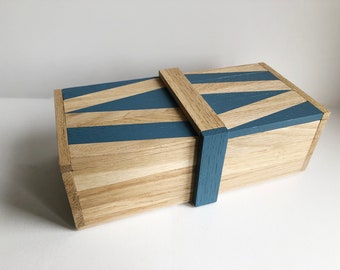 Wooden storage box with geometric patterns. Wooden tea box.