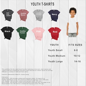 May include: Youth t-shirts in a variety of colours, including dark grey heather, heather mauve, athletic heather, navy, black, heather forest, pink, and red. The t-shirts are shown on a white background with a size chart for youth small, medium, and large. The size chart shows the corresponding age range for each size.