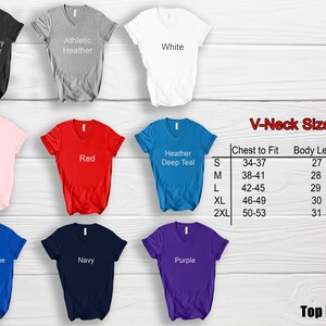 May include: A variety of V-neck t-shirts in different colors, including dark grey, athletic heather, white, pink, red, heather deep teal, royal blue, navy, and purple. A size chart is also included.