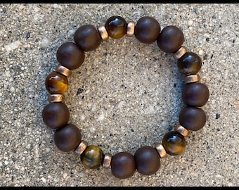 Genuine tiger eye and chocolate wood beaded bracelet with metal bead accent