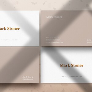 May include: Four business cards with a light brown background and white text. The text on the cards reads "Mark Stoner" and includes contact information, including a phone number, email address, and address.