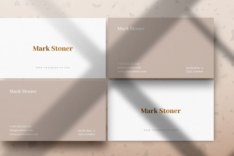 May include: Four business cards with a light brown background and white text. The text on the cards reads "Mark Stoner" and includes contact information, including a phone number, email address, and address.