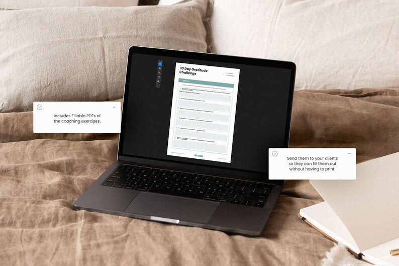 May include: A laptop computer displaying a 30 Day Gratitude Challenge worksheet. The worksheet is a fillable PDF that can be sent to clients. The laptop is on a brown linen bedspread.