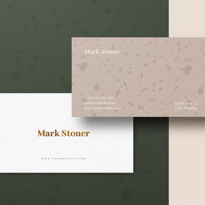 May include: Two business cards with a terrazzo pattern. The top card has the name "Mark Stoner" and contact information. The bottom card has the name "Mark Stoner" and the website address "www.yourwebsite.com".