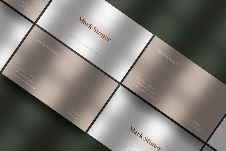 May include: Four business cards with a light brown and white background. The cards feature the name "Mark Stoner" in a brown font and contact information in a white font. The text on the cards includes a phone number, email address, and website address. The cards are arranged in a grid pattern.