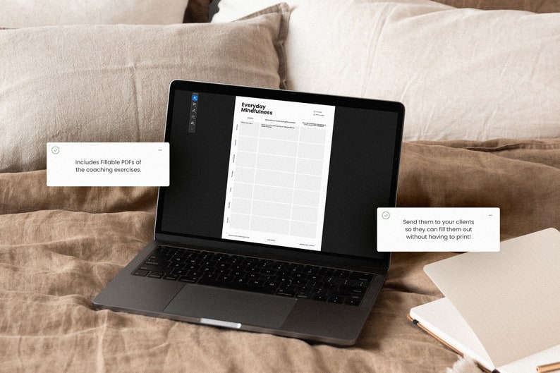 May include: A laptop computer displaying a printable worksheet titled "Everyday Mindfulness". The worksheet is divided into a grid with columns for "Date", "Time", "Activity", "Thoughts", "Feelings", and "Gratitude". The laptop is on a brown linen bedspread.