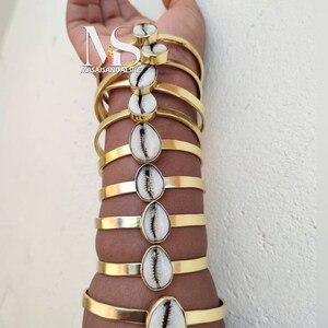 10 Cowrie shell bracelets ,African brass and cowrie bracelets , wholesale brass bracelets , African Brass jewelry ,wholesale brass jewelry