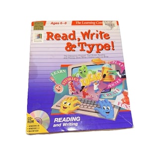 May include: A Read, Write & Type! CD-ROM software box for ages 6-8. The cover features a lined paper background, a computer monitor graphic with cartoon characters, and the text Reading and Writing. It includes Windows 95 and 3.1 compatibility.