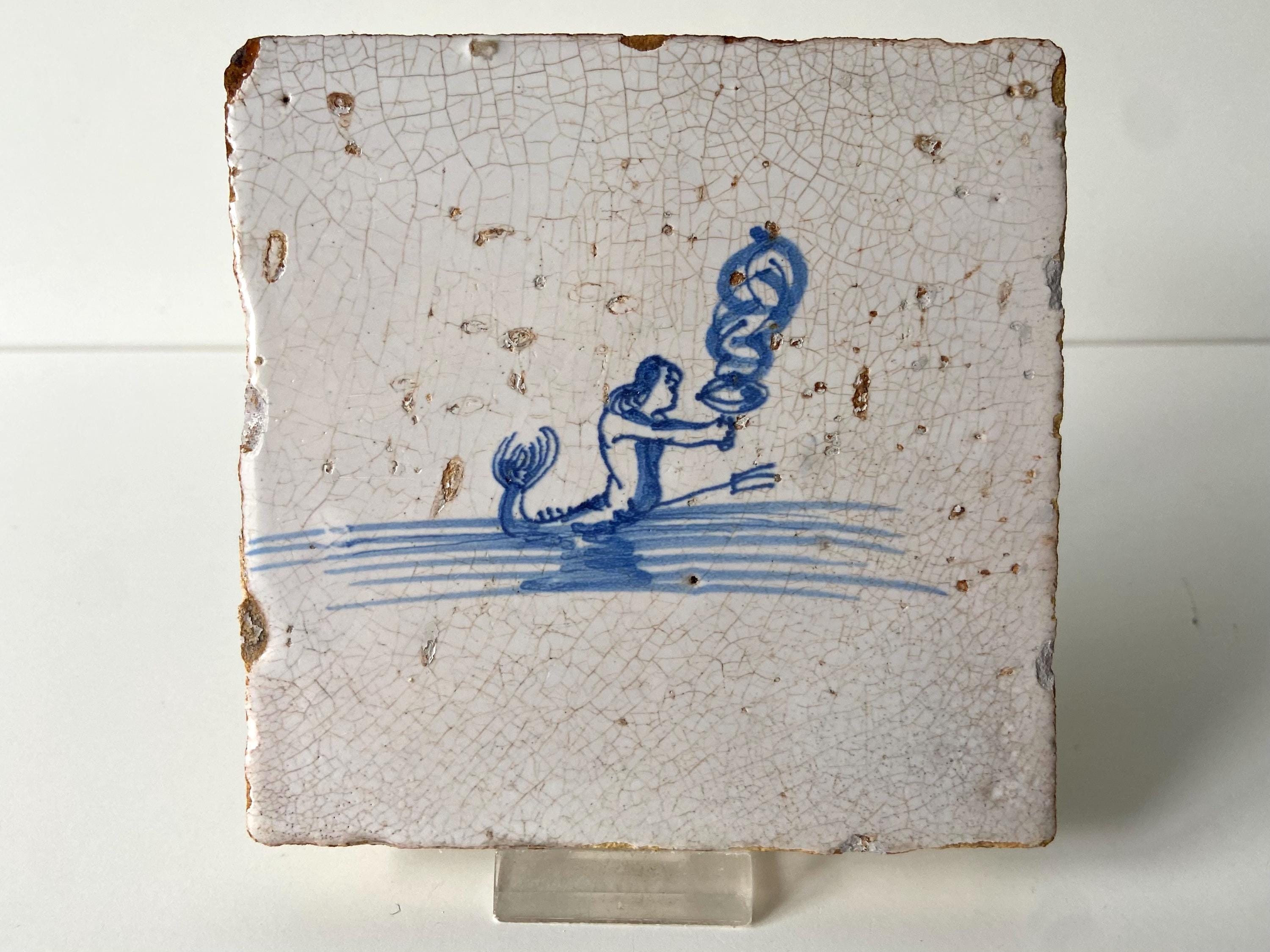 17th century Delft tile - Sea creature with holding a toch - Blue and white - Wall - Kitchen - Fireplace