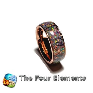 May include: A rose gold ring with a band of iridescent opal inlay. The ring is a wide band with a smooth, polished finish.