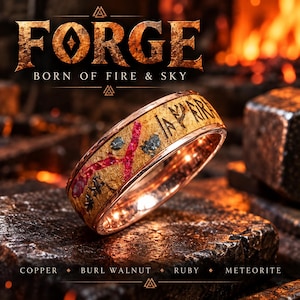 May include: A ring featuring a band of burl walnut wood inlaid with fragments of meteorite and a vibrant red ruby. The interior of the ring is polished copper. The text FORGE BORN OF FIRE & SKY and COPPER BURL WALNUT RUBY METEORITE is visible.