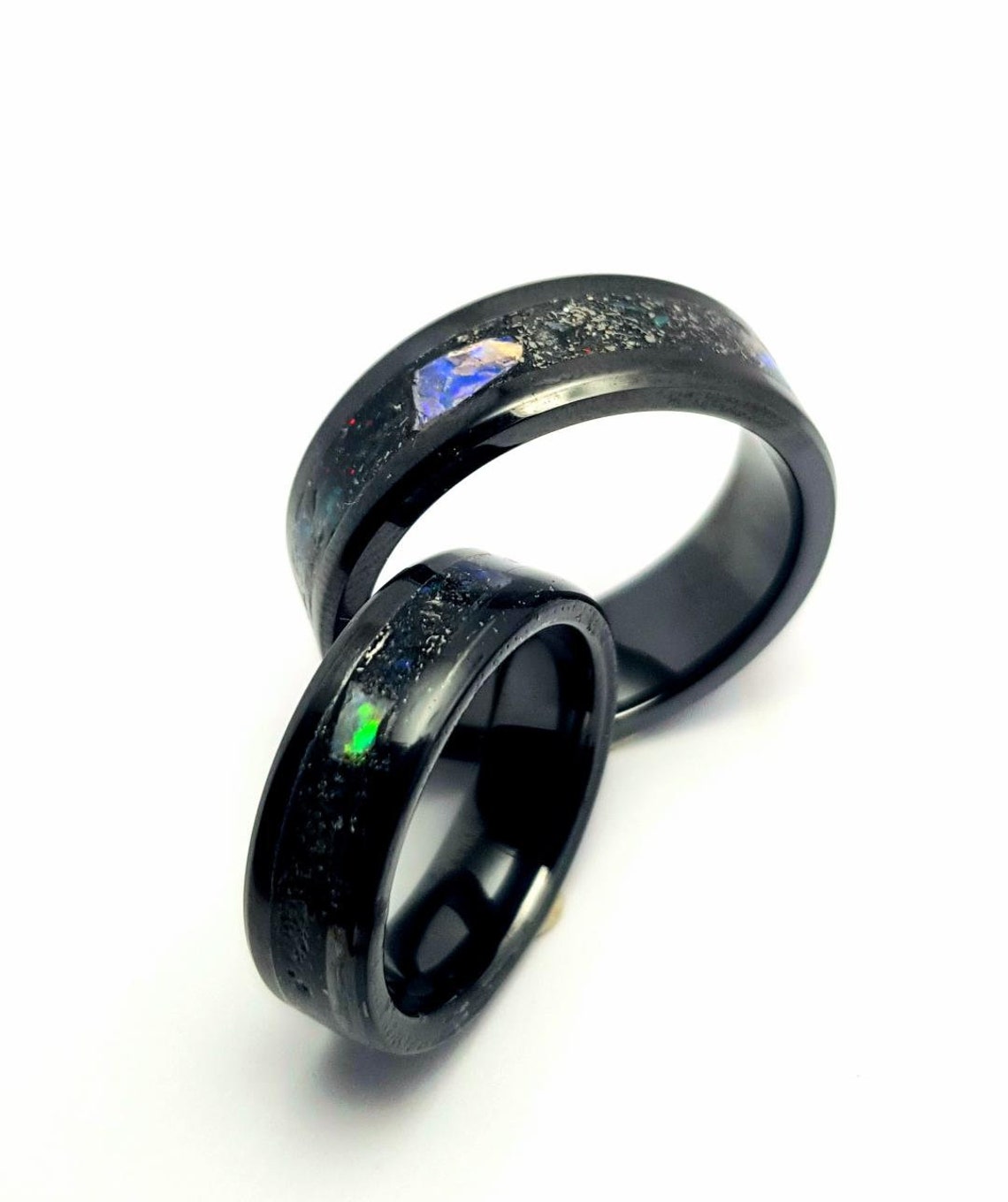 Pair of Meteorite and Opal rings set in black ceramic band