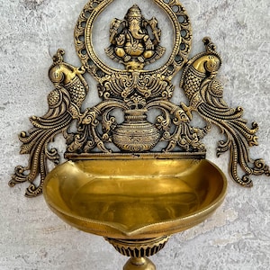 Brass 17” Inch Wall Hanging Lord Ganesha with Oil Diya in intricate carving;Brass Vinayaka wall frame;Hindu Ganapati home decor;Housewarming