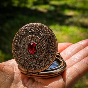 Seer’s Veil Black Scrying Mirror Pocket Watch – Gothic Witchcraft Divination Tool, Portable Wiccan Altar & Occult Meditation Mirror Bronze Red Gem