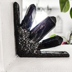 May include: Black crystal corner shelf decor with silver glitter accents