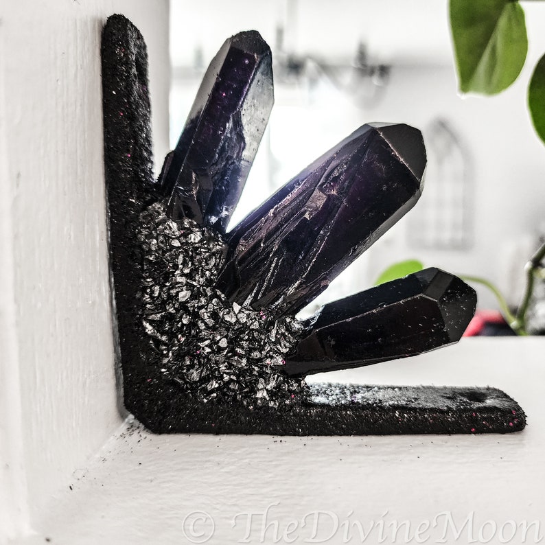 May include: Black crystal corner shelf decor with silver glitter accents