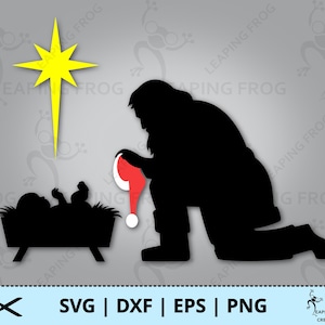 May include: A black silhouette of a person kneeling beside a manger with a baby inside. A yellow star shines above the manger. The person is holding a red hat.