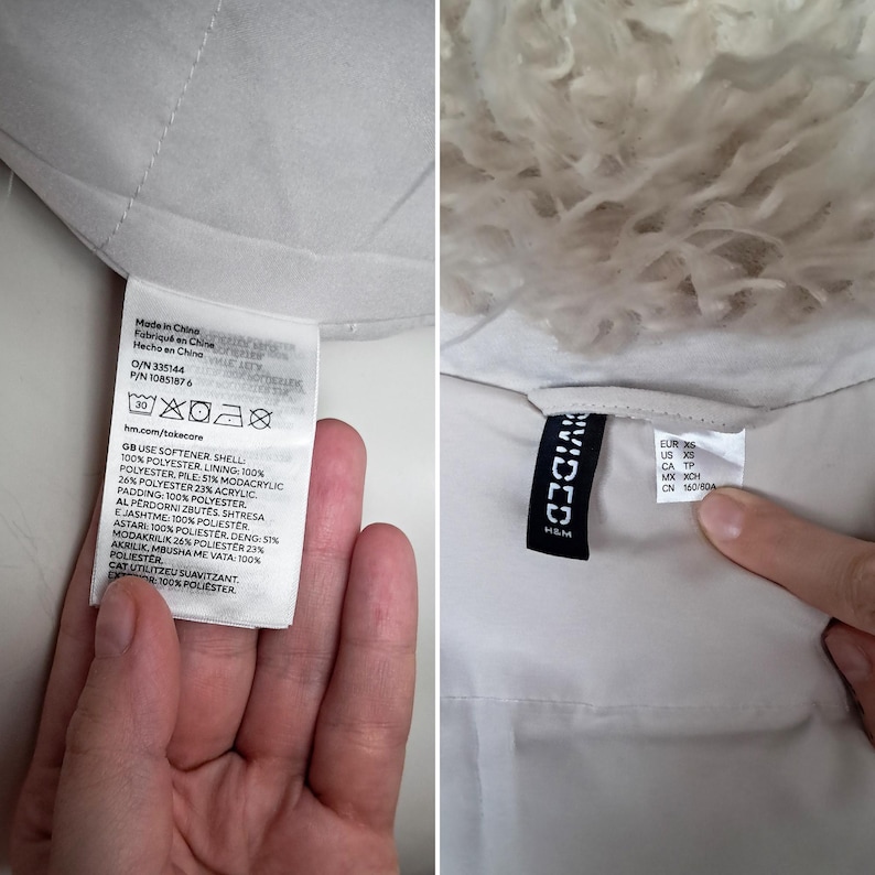 May include: Two close-up shots of a white garment. One shows a tag with washing instructions and fabric composition details, including '100% polyester'. The other shows a tag with the brand 'Divided' and size information. The garment appears to have a fluffy, light-colored trim.