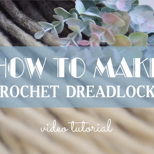 May include: How to Make Crochet Dreadlocks video tutorial. A close-up image of a group of crocheted dreadlocks in shades of brown and blonde.