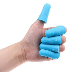 May include: A hand wearing several light blue finger protectors. The finger protectors are made of a flexible material and have a textured surface with small, raised dots. The thumb is covered by a single protector, while the other fingers each have one.