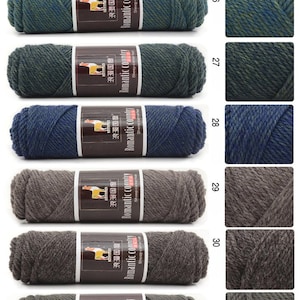 May include: A selection of yarn skeins in various colors, including purple, green, blue, gray, and brown. The yarn is labeled "Romantic Country" and "Sheep camel hair".